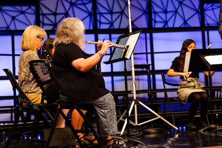 Orchestra providing instrumental support during traditional worship at Kennesaw First.