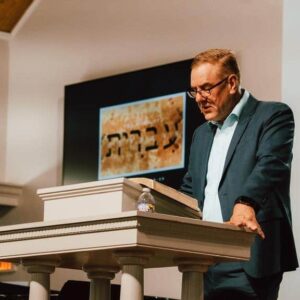 Congregation rejoicing and worshiping through hymns, choir anthems, and solos at Kennesaw First Baptist Church Classic Service.