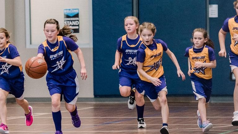 Kids playing basketball during an Upward Basketball league at Kennesaw First Baptist Church.