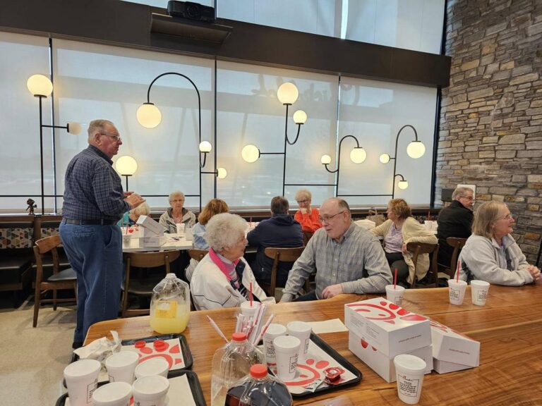 Senior adults participating in spiritual activities as part of the Forever Young ministry at Kennesaw First Baptist Church.